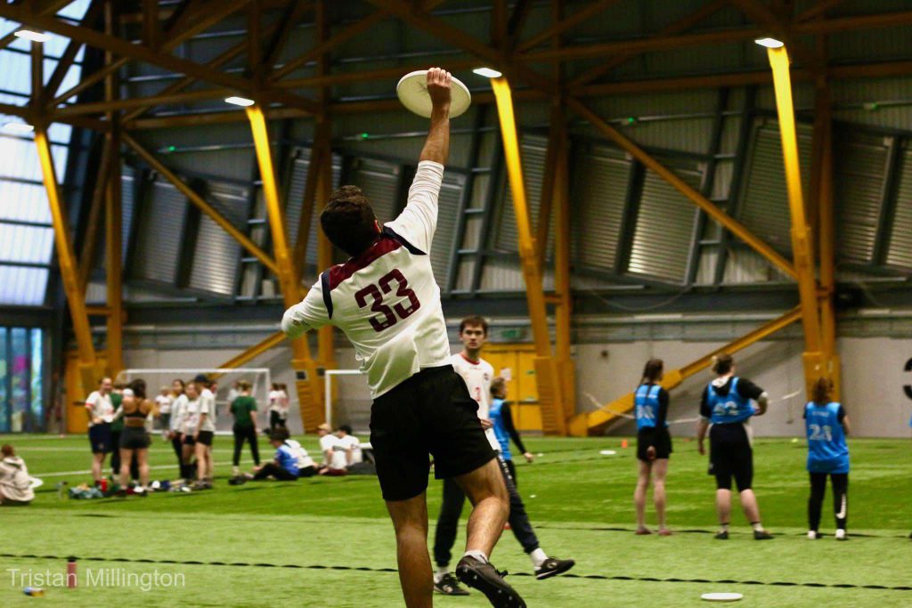 Photo by Tristan Millington. Strathclyde player catches a disc high in the air. 