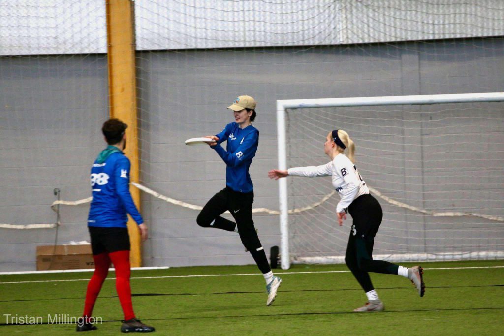 Photo by Tristan Millington. Saints player catching a disc in the endzone. 